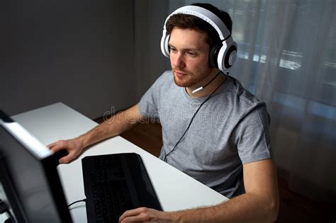Man In Headset Playing Computer Video Game At Home Stock Image Image