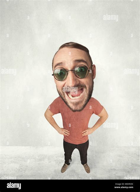 Funny Person With Big Head Makes Jesting Facial Expression Stock Photo