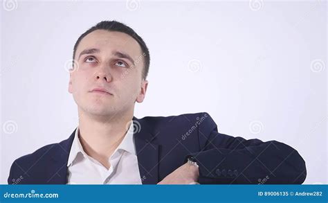 Portrait Of An Expressive Young Man In Suit On Isolated Background