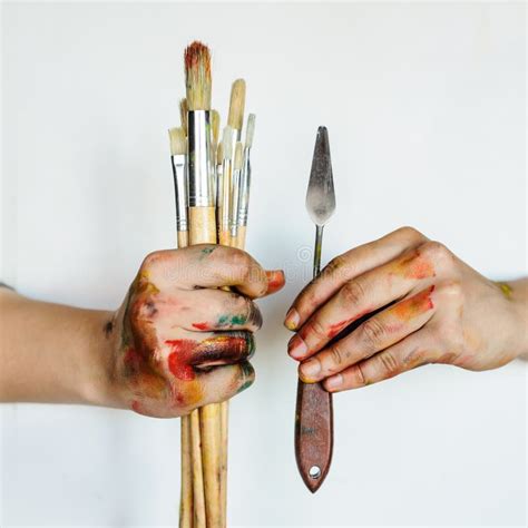 Close Up Of An Artistpainter Hands Holding Paint Brushes Stock Image