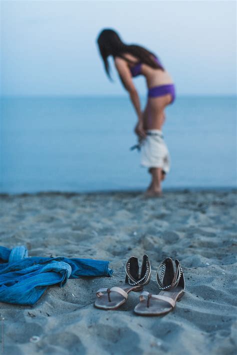 Woman Undress On The Beach At Sunset By Stocksy Contributor Mauro Grigollo Stocksy