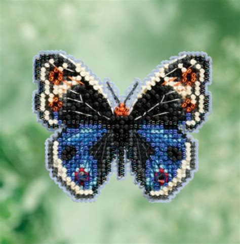 Cross is a geometric shape consisting of two intersecting lines or bars, usually perpendicular to each other. Adding seed bead embellishments to a cross stitch project