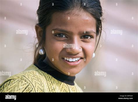 A Young Girl At The Ganges Riverside In The Hindu Holy City Of Varanasi
