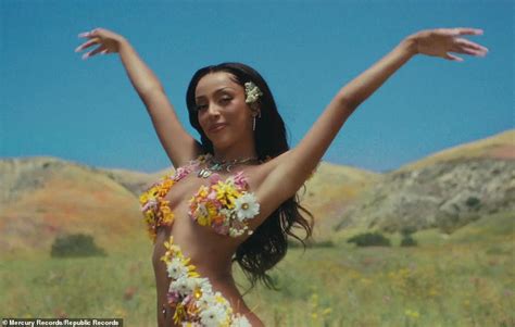 Doja Cat Runs Topless Through A Meadow In New Post Malone Music Video