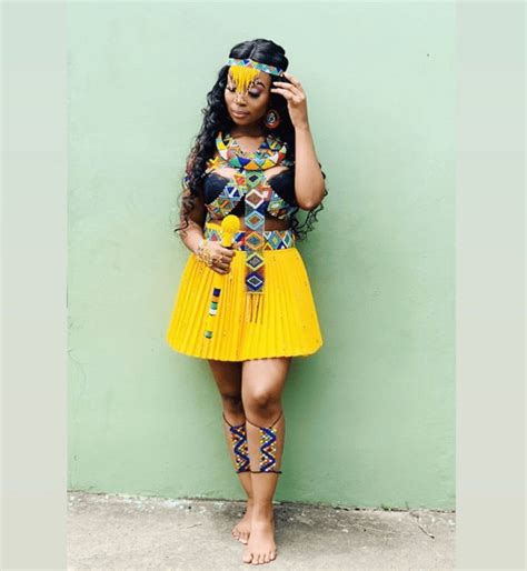 clipkulture zulu maiden in umemulo traditional beaded accessories and yellow patterned skirt