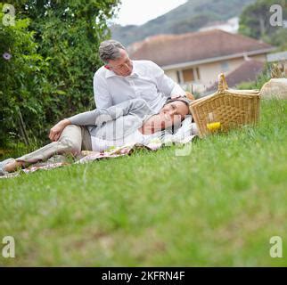Attractive Mature Couple Relaxing On The Beach Stock Photo Alamy