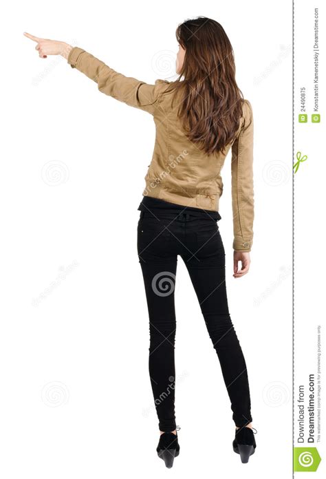 Download female back stock photos. Back View Of Young Brunette Woman Pointing Stock Image - Image: 24490875