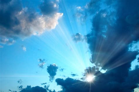 Free Sunburst In Cloudy Sky Stock Photo