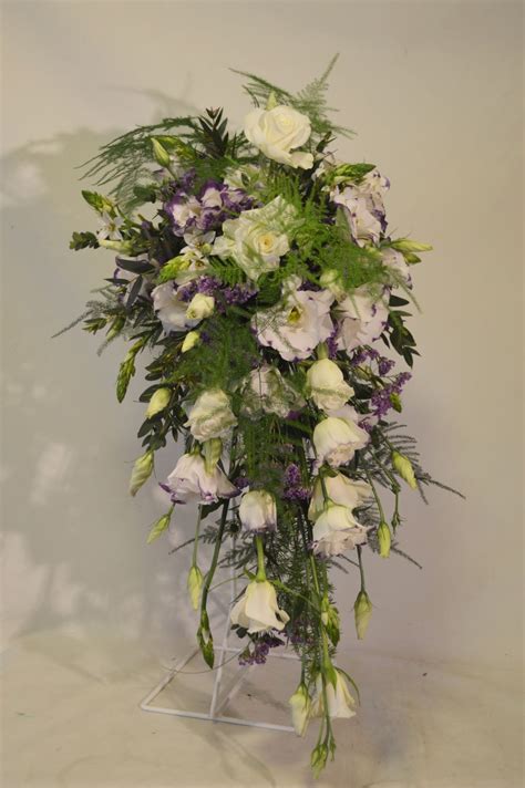 A Shower Bouquet Using Delicate White Lisianthus Edged With Purple