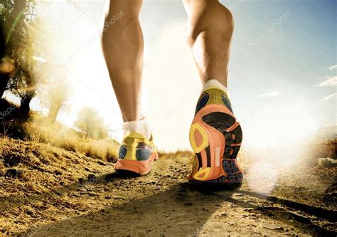 Strong Legs And Shoes Of Sport Man Jogging In Fitness Training Workout On Off Road Stock Photo