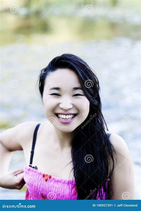 smiling attractive japanese american woman at river stock image image of cute woman 100927391