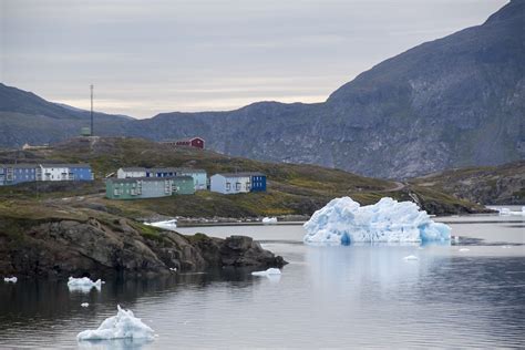 Iceberg And Buildings In Narsaq Greenland Itilleq Harbor Maggie