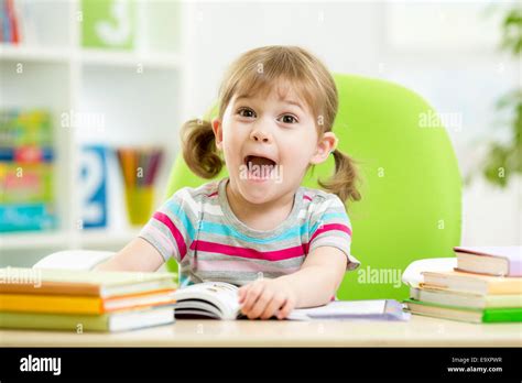 Female Elementary Pupil Reading In Hi Res Stock Photography And Images
