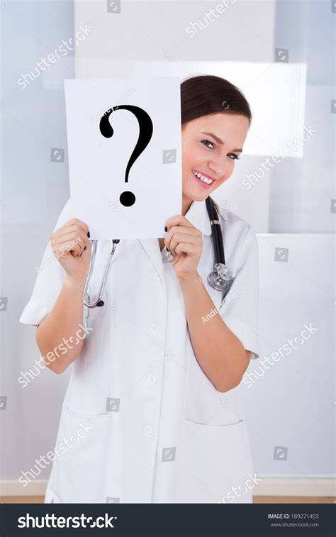 Young Female Doctor Holding Question Mark Stock Photo 189271403