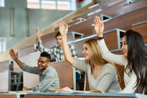 College Students Raising Hands Lecture Hall Stock Photos Free