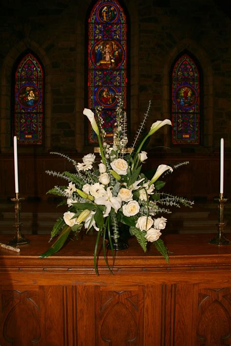 Unique Altar Arrangement With White Calla Lilies Roses And Foliages