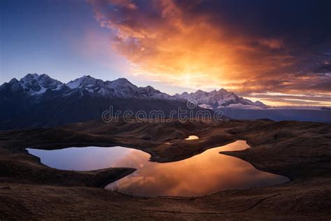 Beautiful Sunrise In Mountains Near Lake Stock Image