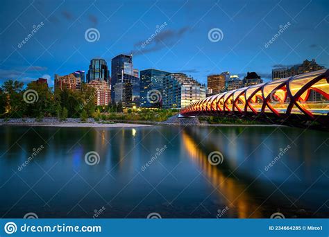 Peace Bridge Across The Bow River And Calgary Skyline Photographed At