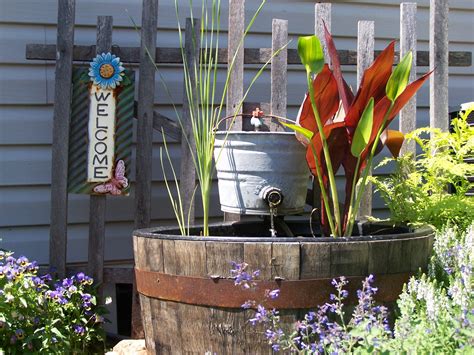 Whiskey barrel fountain and pond plants | Garden project, Whiskey