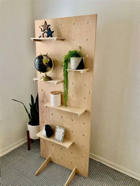 Peg boards with hooks hang items vertically to save space too. 75″ Tall Modern Large Display Pegboard with Stand - 木材 Diy 2020