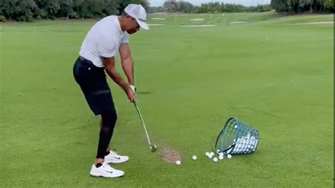 See Tiger Woods Back Golfing Nine Months After Car Rollover Crash Cnet