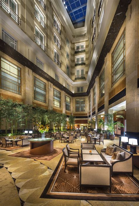 The Courtyard Located In The Sunlit Atrium Lobby Of The Hotel The