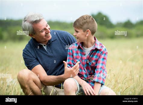 Grandfather And Grandson Bonding Outdoors Stock Photo Alamy