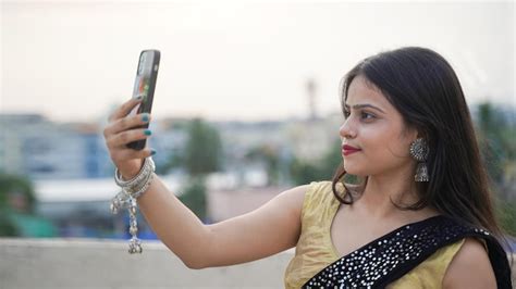 Premium Photo Beautiful Indian Girl Taking Selfie On Her Mobile Phone