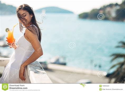 Carefree Young Female On Holiday Summer Vacation Having Fun On A Sunny