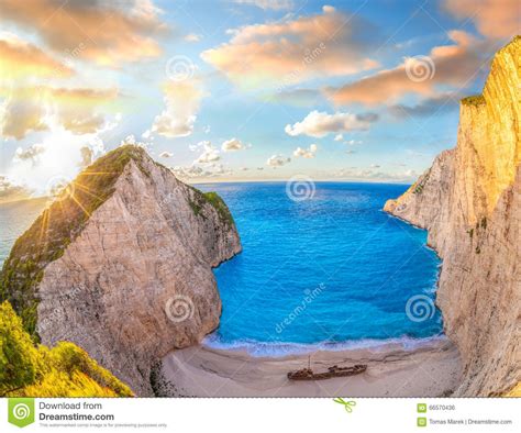 Navagio Beach With Shipwreck Against Colorful Sunset On