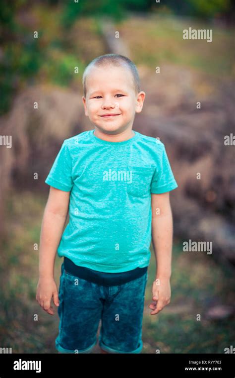Outdoor Portrait Of Cute Little Smiling Boy Stock Photo Alamy