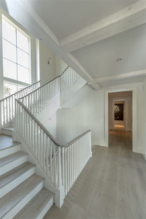 Custom Designed Staircase With Stained Oak Hand Railing Floors