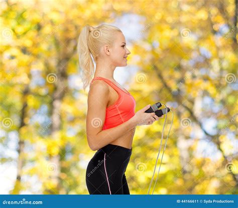 smiling sporty woman with skipping rope stock image image of rope exercise 44166611