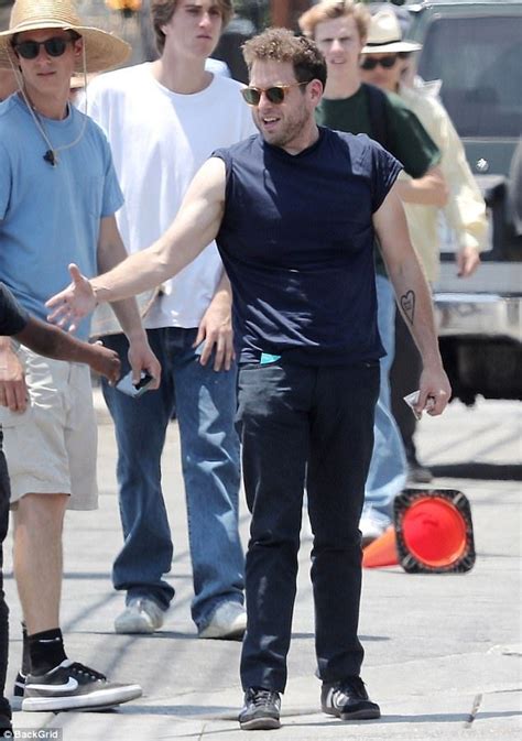 Jonah Hill Shows Off Bulging Biceps As He Rolls Shirt On Mid 90s Set