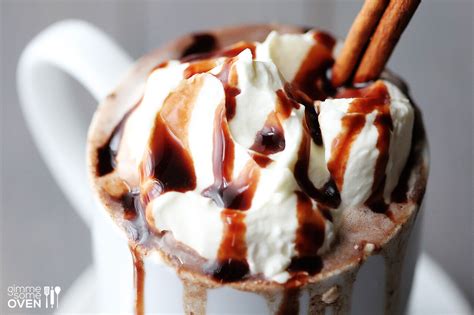 Pour warm milk mixture over chocolate; Mexican Spiced Hot Chocolate | Gimme Some Oven