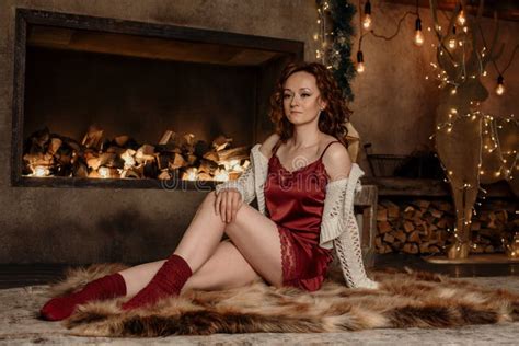 A Photo Shoot Of A Gorgeous Girl Near The Fireplace Stock Photo Image