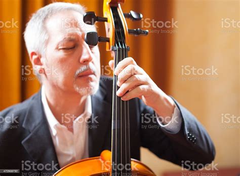 Man Playing Cello In A Concert Hall Stock Photo Download Image Now