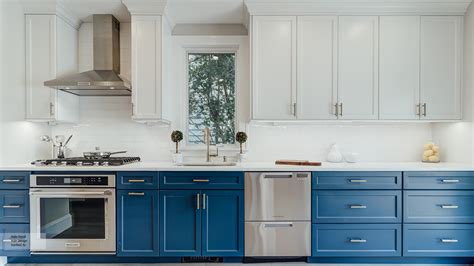 Another paint color that is excellent to pair with maple kitchen cabinets is white. Casual Blue and White Painted Maple Kitchen Cabinets - Omega