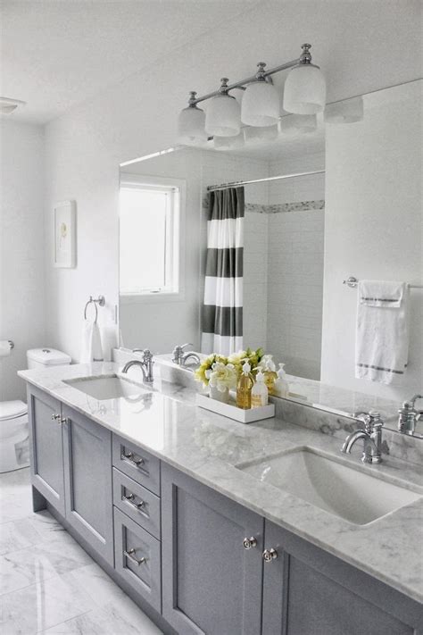 Luxurious master bathrooms will usually have expensive bathroom features, glass shower doors, and fancy lighting design. Decorating Cents: Gray Bathroom Cabinets