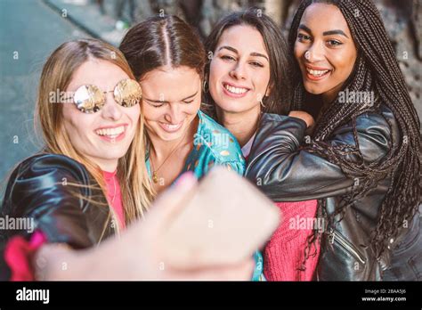 Group Of Multiracial Four Girls Taking Selfie With Their Smartphone Lifestyle Woman Friendship