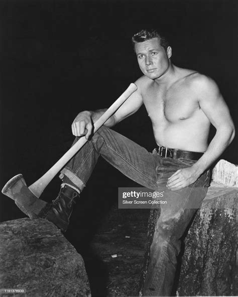 American Actor John Smith Posing With An Axe Circa 1960 News Photo