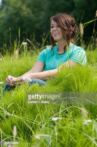 Casual Portrait Of An 18year Old Teen Girl Smiling And Sitting In A