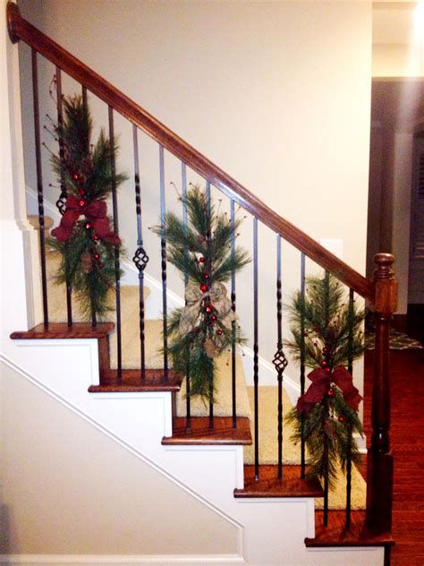 Best christmas garland ideas you can think of. Christmas swags tied to stair railing instead of wrapping ...