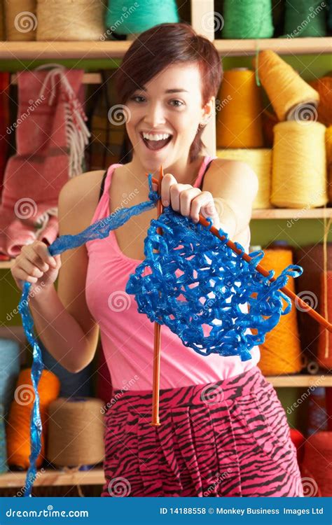 Woman Holding Knitting Standing In Front Of Yarn Stock Photo Image Of