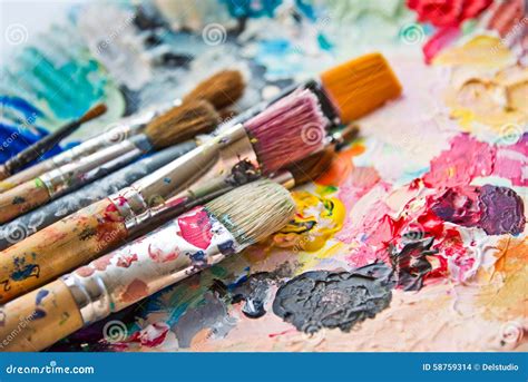 Used Paint Brushes On A Colorful Palette Stock Photo Image Of