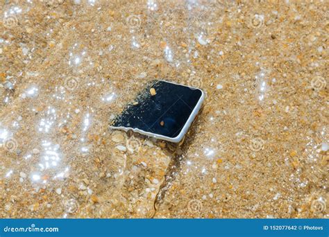 Unknown Woman Has Dropped Her Phone Into The Water Stock Photo Image