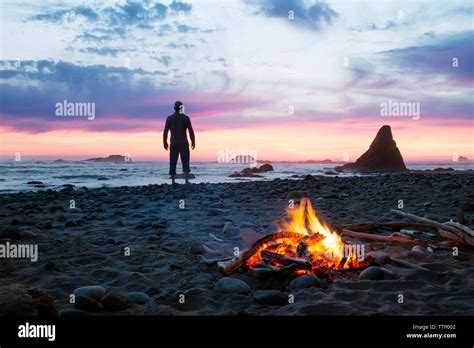 Silhouette Man Standing At Beach During Sunset Stock Photo Alamy