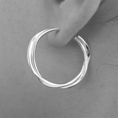 It can be very difficult to know what to look for when buying sterling silver hoop fine earrings. Solid Sterling Silver Interwoven Hoop Earrings By Otis ...