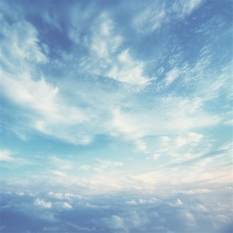 Premium Ai Image There Is A Plane Flying In The Sky With Clouds Above
