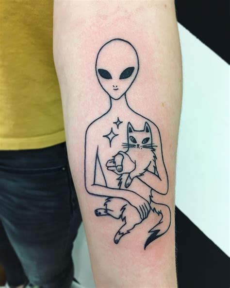 There are several unique alien tattoo designs that can leave others in awe. Alien and cat tattoo | Alien tattoo, Cute small tattoos, Funny tattoos